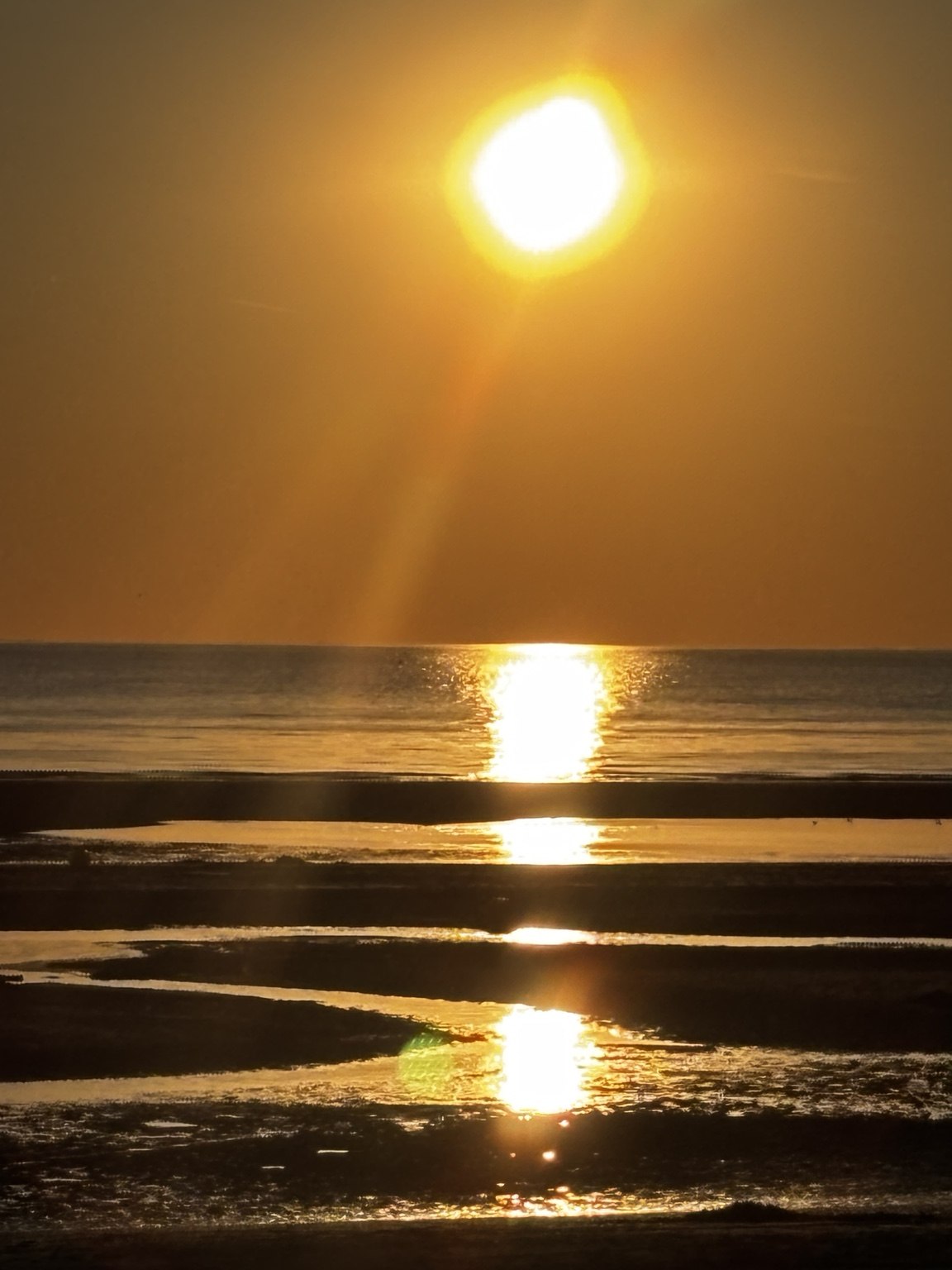 Un coucher de soleil sur la côte